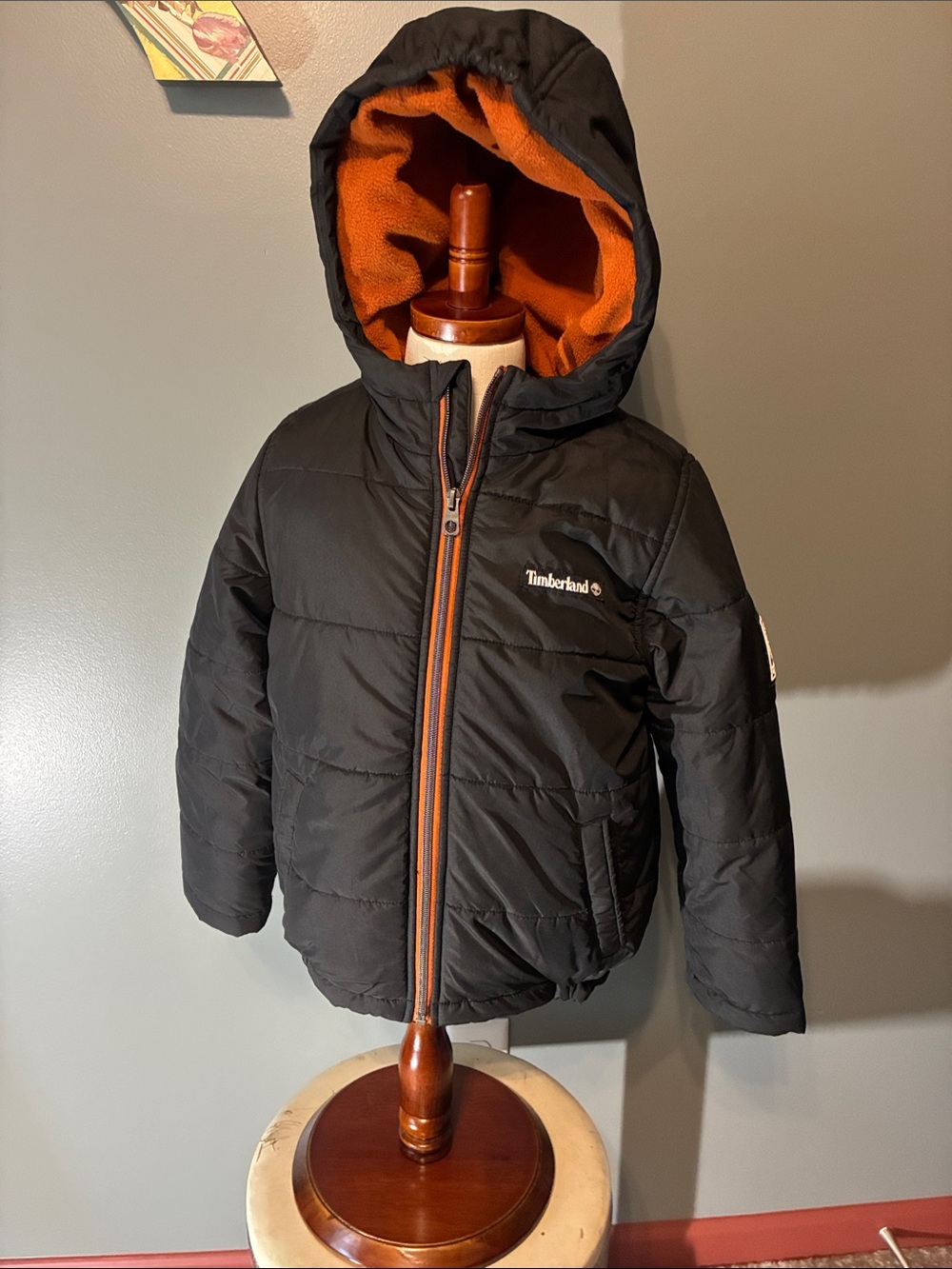 Timberland Kids Large (6) Unisex Black Puffer Jacket with Orange Hood Lining.